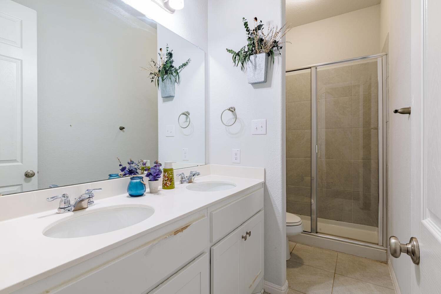 1913 Equine Road Leander, TX 78641 - Photo 18 of 35 a bathroom with a shower sink vanity and mirror