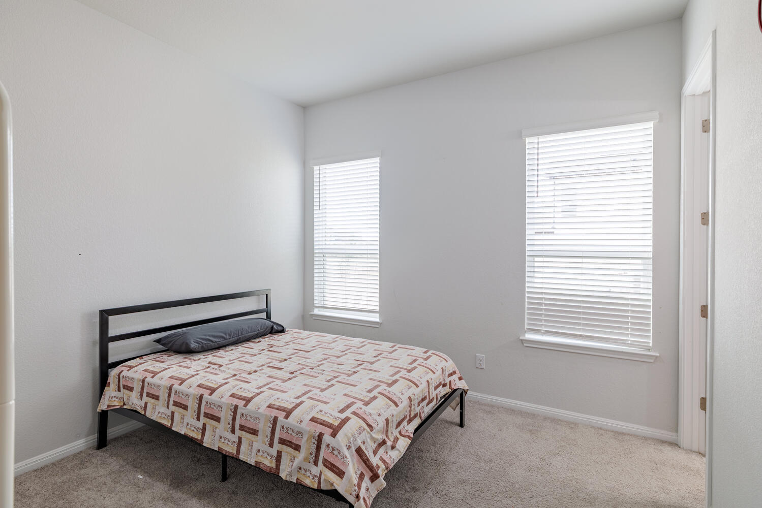 1913 Equine Road Leander, TX 78641 - Photo 23 of 35 a bedroom with a bed and window