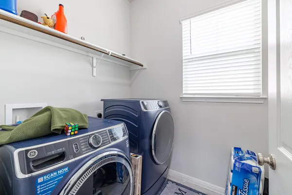 a utility room with dryer and washer