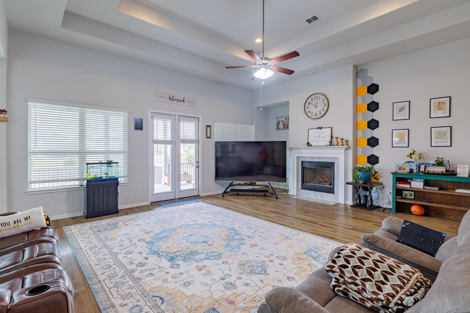 1913 Equine Road Leander, TX 78641 - Photo 8 of 35 a living room with furniture a flat screen tv and a fireplace