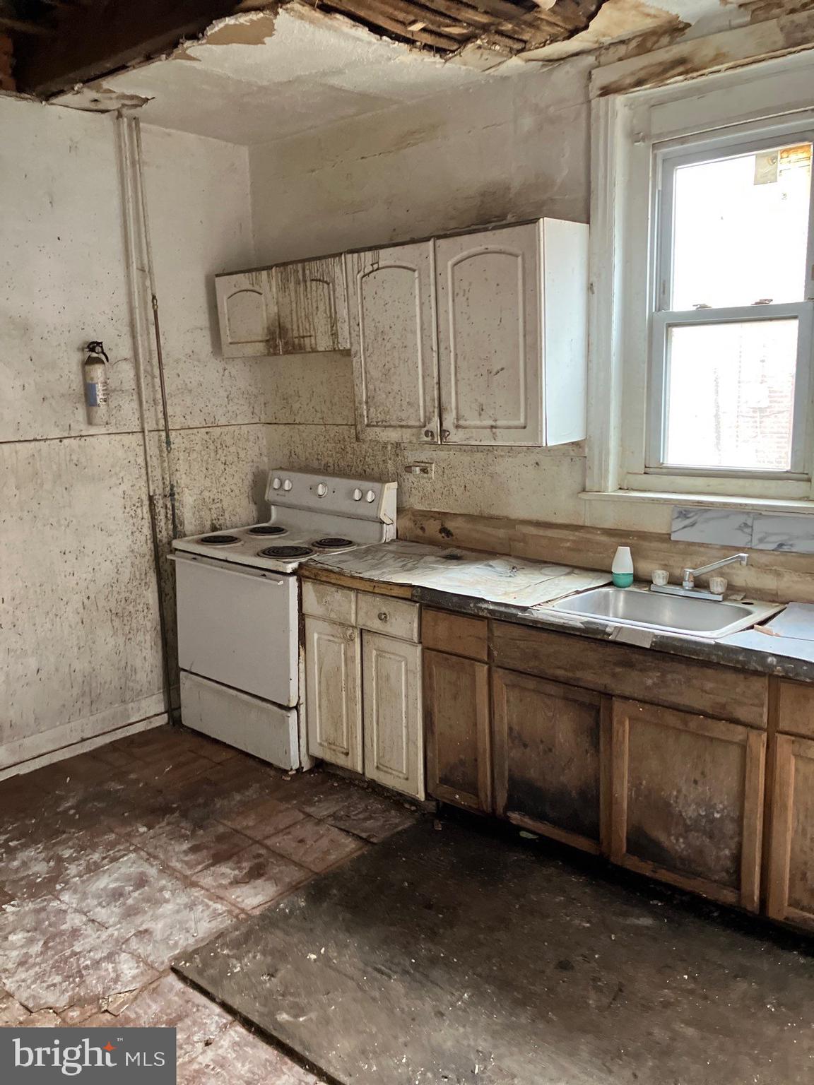 1233 Crosby Street Chester, PA 19013 - Photo 12 of 30 a kitchen with a sink and cabinets