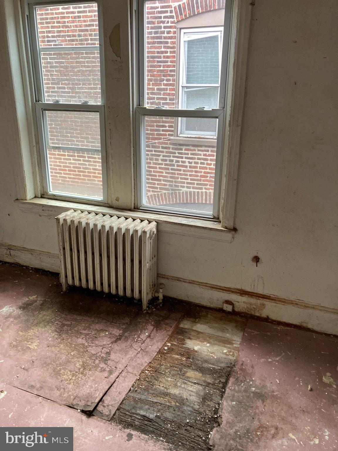 1233 Crosby Street Chester, PA 19013 - Photo 17 of 30 a view of an empty room with a window