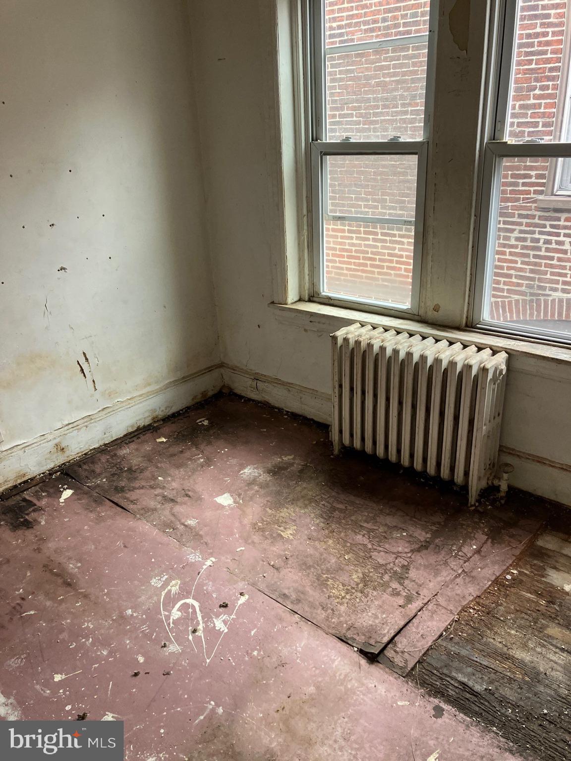 1233 Crosby Street Chester, PA 19013 - Photo 19 of 30 a view of an empty room with a window