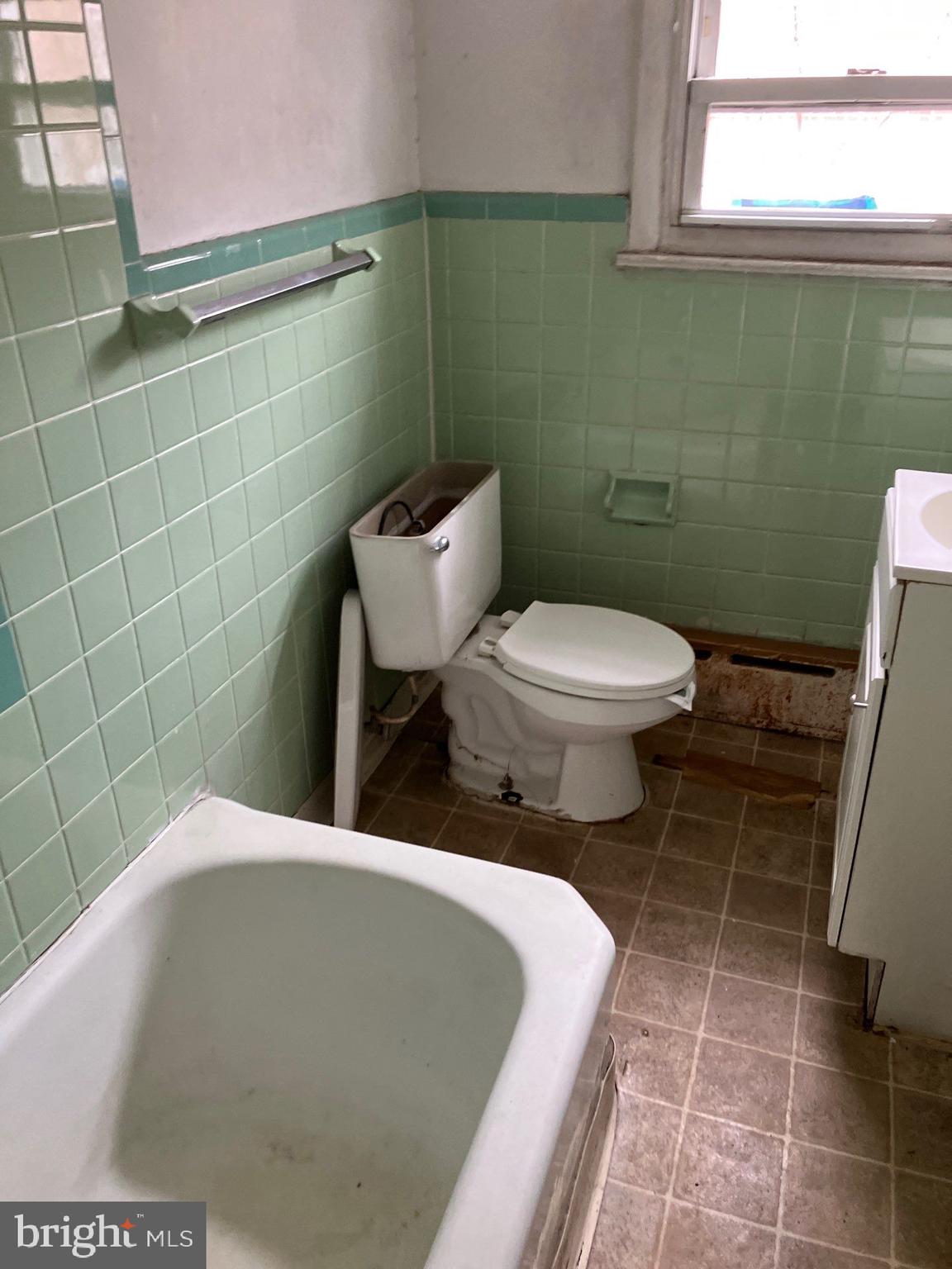 1233 Crosby Street Chester, PA 19013 - Photo 20 of 30 a bathroom with a toilet and a sink