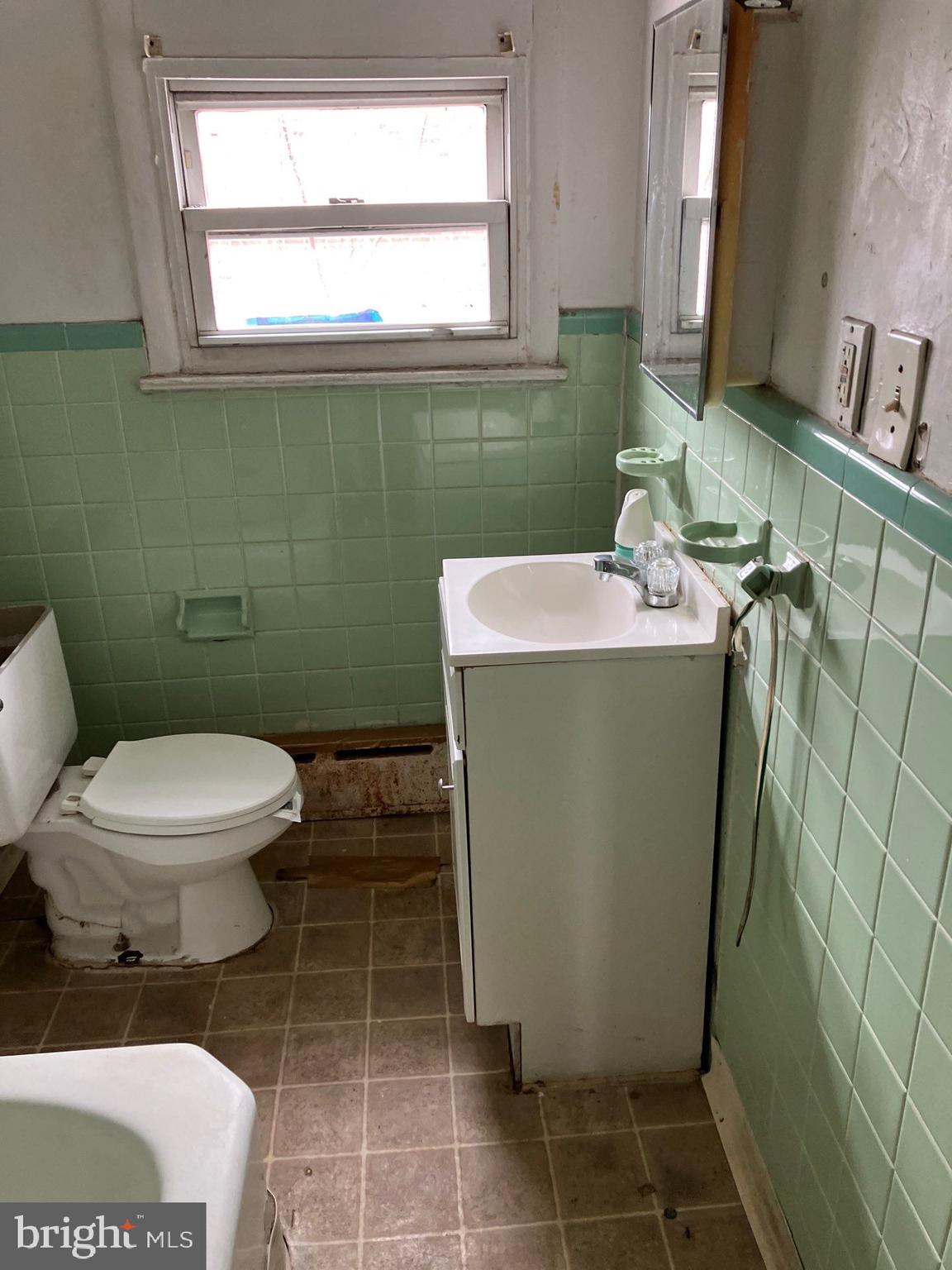 1233 Crosby Street Chester, PA 19013 - Photo 21 of 30 a bathroom with a toilet and a sink