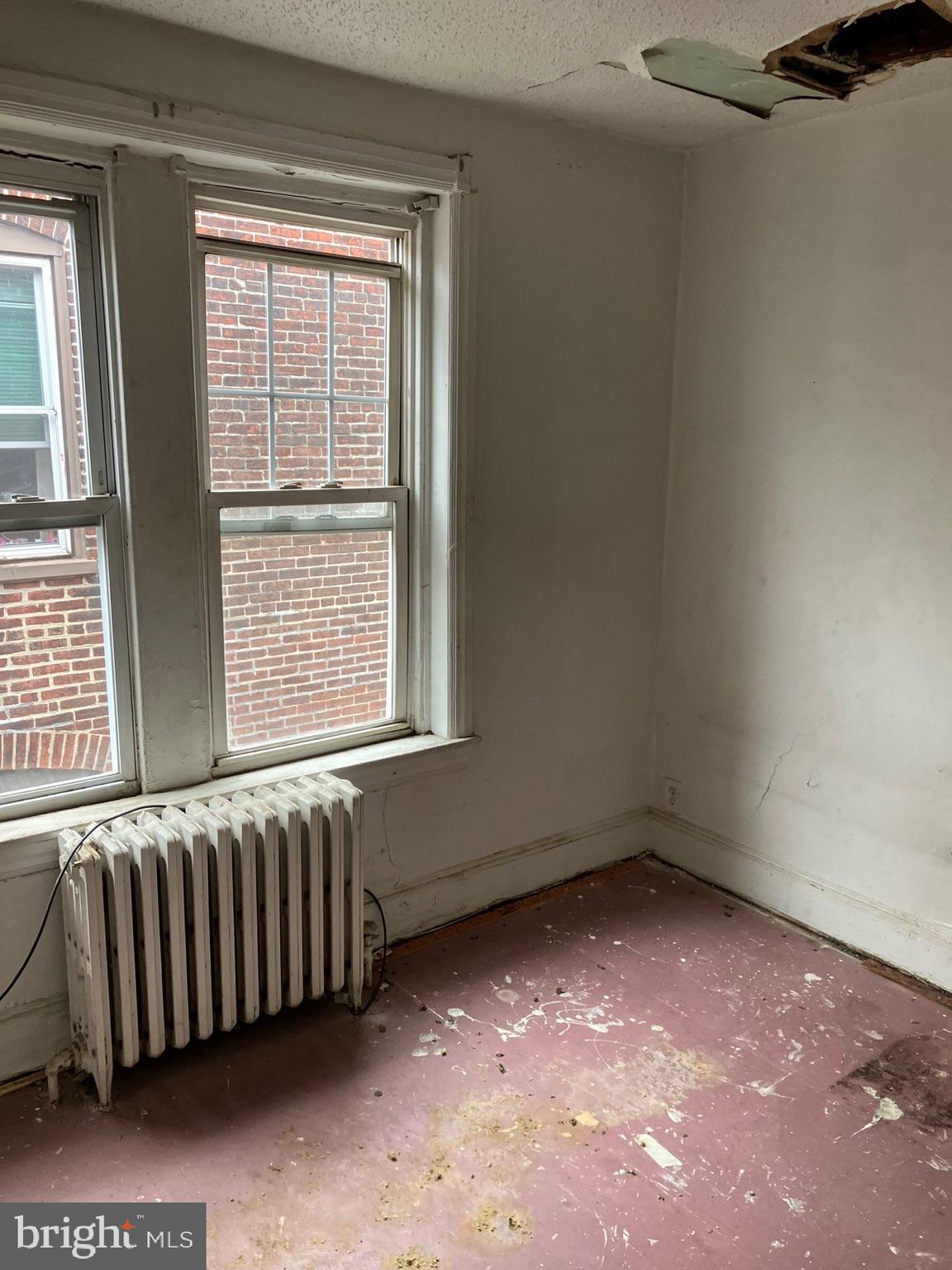 1233 Crosby Street Chester, PA 19013 - Photo 26 of 30 a view of an empty room with a window