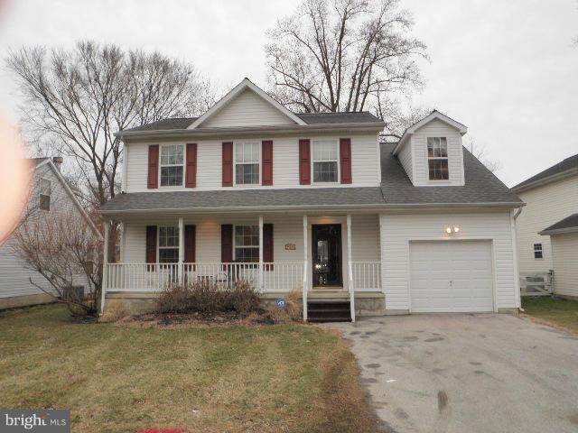 515 Tulip Road Riva, MD 21140 - Photo 1 of 30 a front view of a house with a yard and garage