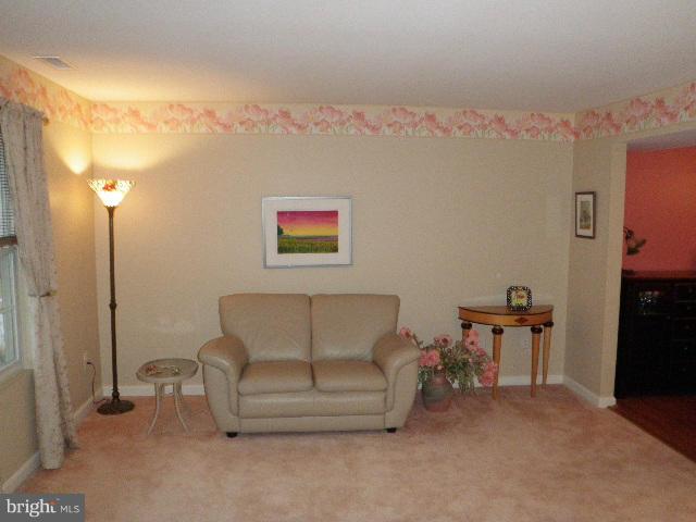 515 Tulip Road Riva, MD 21140 - Photo 2 of 30 a living room with furniture and a flat screen tv