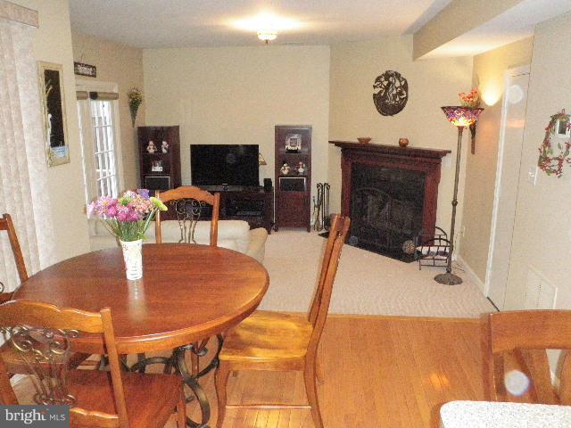 515 Tulip Road Riva, MD 21140 - Photo 12 of 30 a dining room with furniture and a fireplace