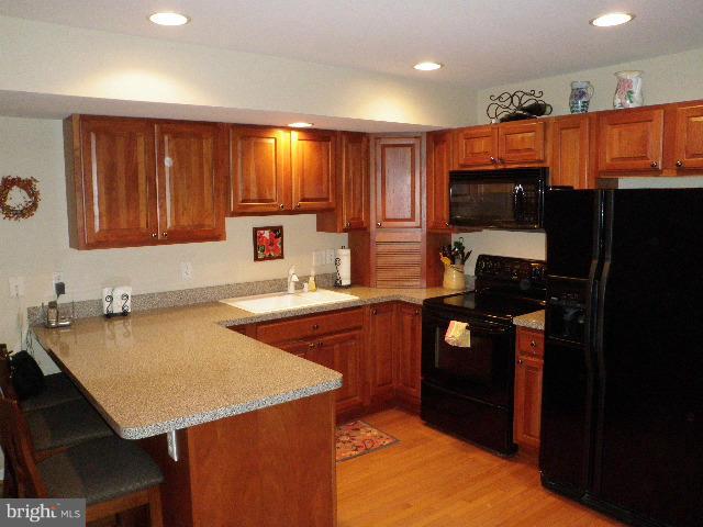 515 Tulip Road Riva, MD 21140 - Photo 14 of 30 a kitchen with a refrigerator and a sink