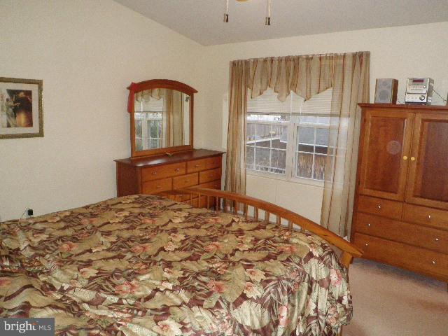 515 Tulip Road Riva, MD 21140 - Photo 18 of 30 a bedroom with a bed and wooden floor