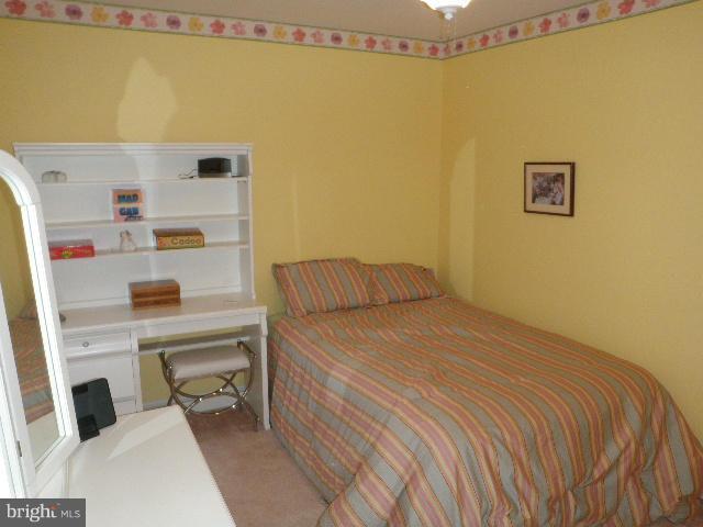 515 Tulip Road Riva, MD 21140 - Photo 22 of 30 a bedroom with a bed and a dresser