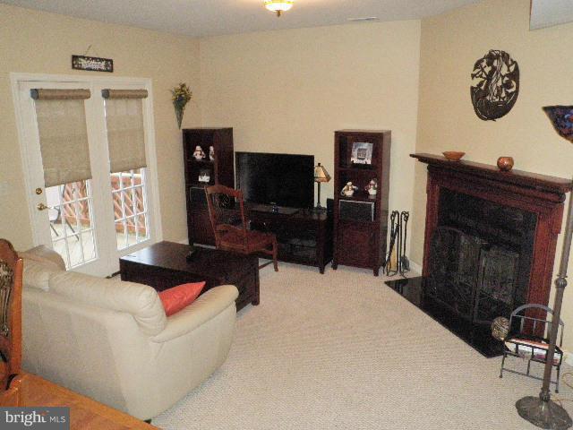 515 Tulip Road Riva, MD 21140 - Photo 7 of 30 a living room with furniture and a flat screen tv