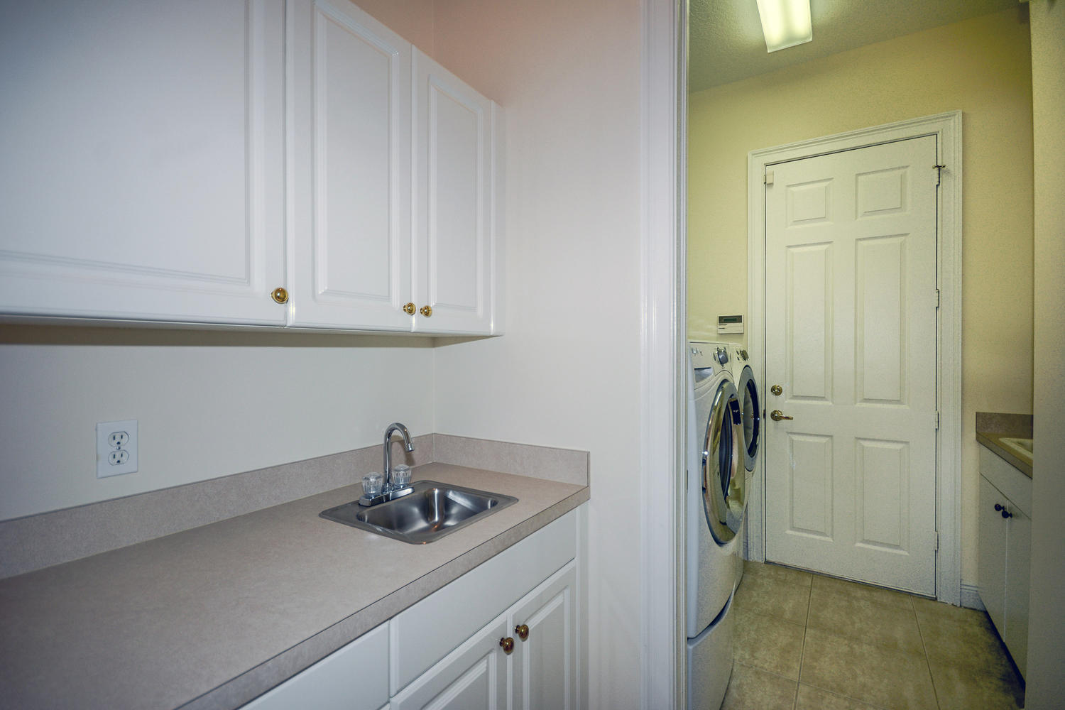 982 Southwest Blue Stem Way Stuart, FL 34997 - Photo 20 of 37 Laundry Room with lots of storage