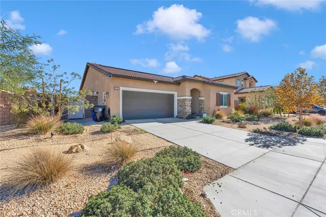 a kitchen with a sink dining table and chairs