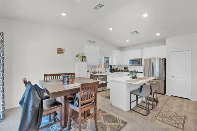 a kitchen with a sink stove and refrigerator