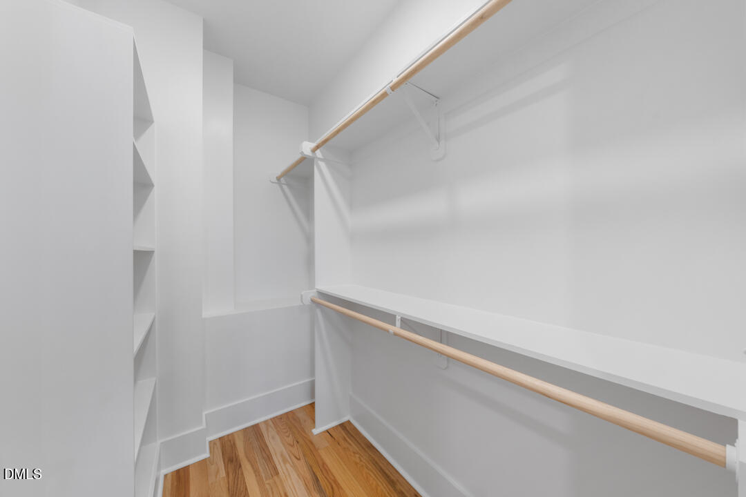 2530 West Wilson Street Durham, NC 27705 - Photo 26 of 49 a view of walk in closet with empty racks