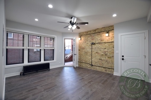 6109 North Winthrop Avenue, Unit 2 Chicago, IL 60660 - Photo 4 of 15 a view of an empty room with glass door