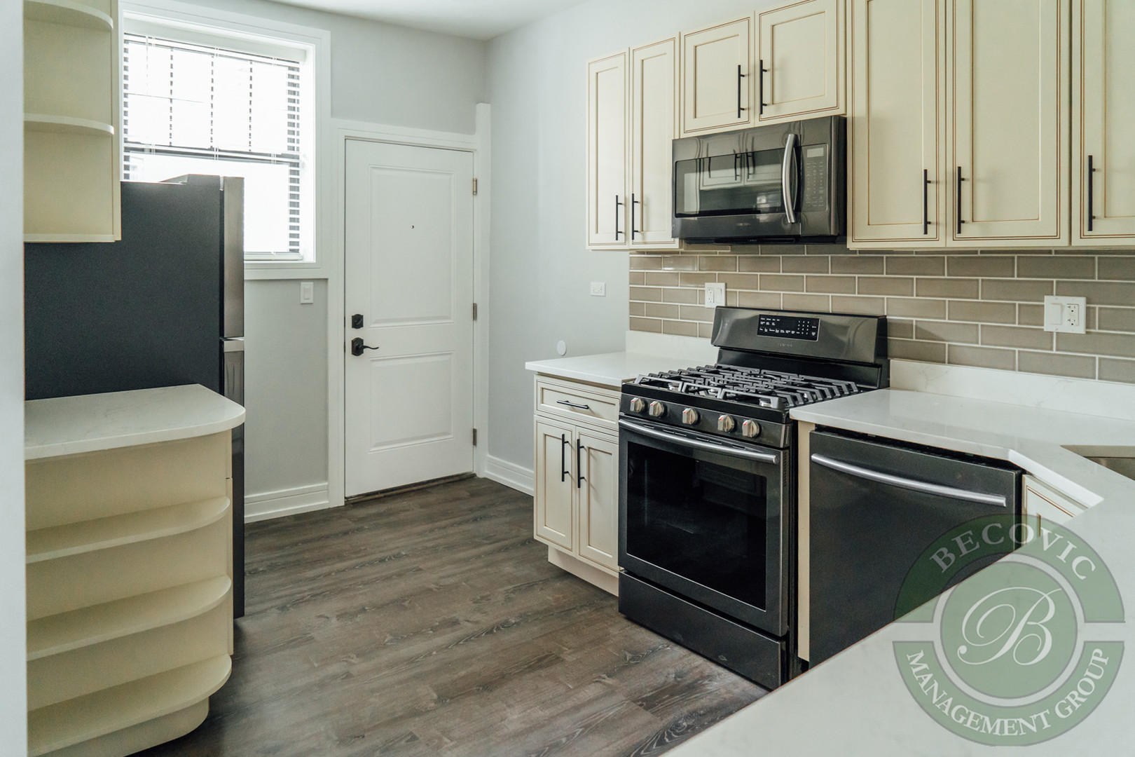 6109 North Winthrop Avenue, Unit 2 Chicago, IL 60660 - Photo 6 of 15 a kitchen with cabinets and steel stainless steel appliances