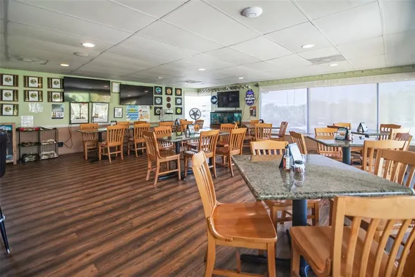 a view of a dining room with furniture window and wooden floor