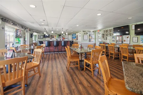 a view of a dining room with furniture window and wooden floor