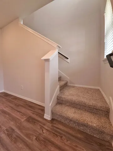 a view of entryway with wooden floor and window