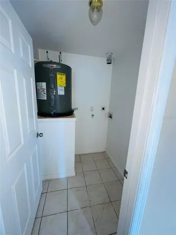 an empty room with sliding door and windows