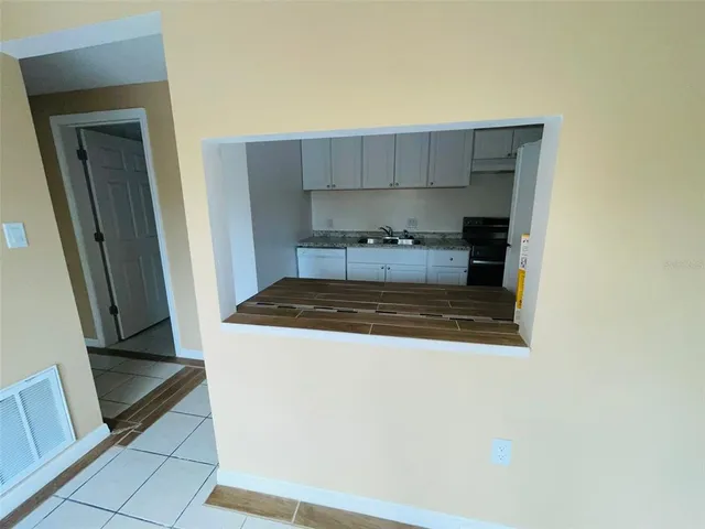 a kitchen with a stove and a refrigerator
