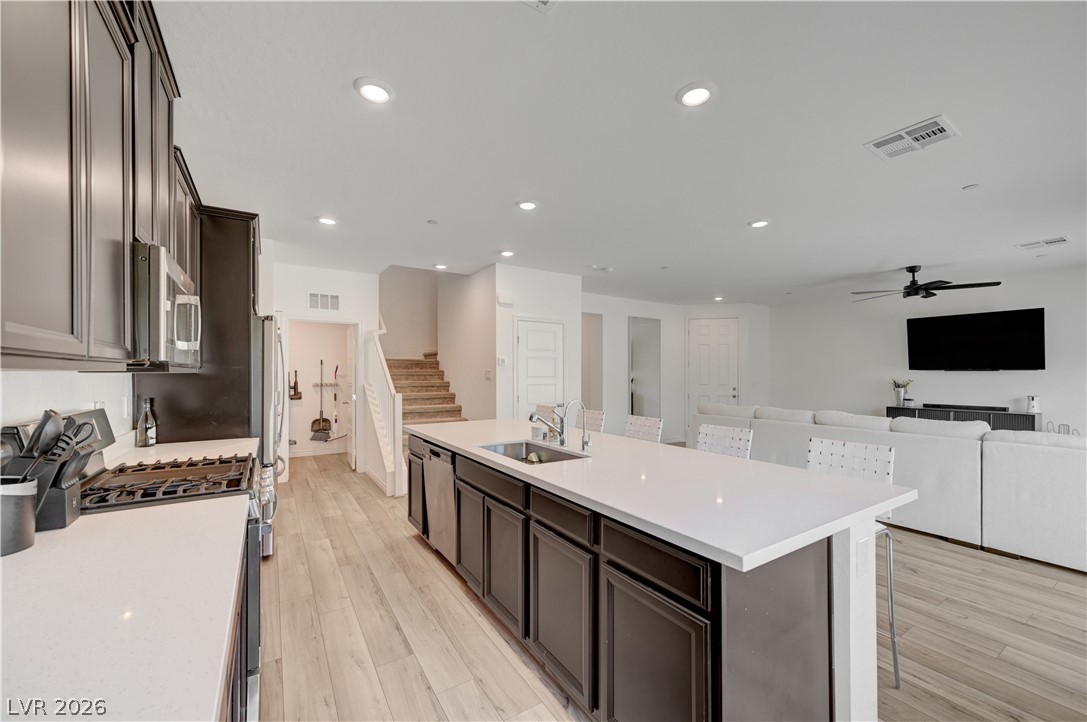 7204 North Decatur Boulevard, Unit 3 North Las Vegas, NV 89084 - Photo 14 of 48 A contemporary open-concept layout connects the kitchen, dining area, and living space.