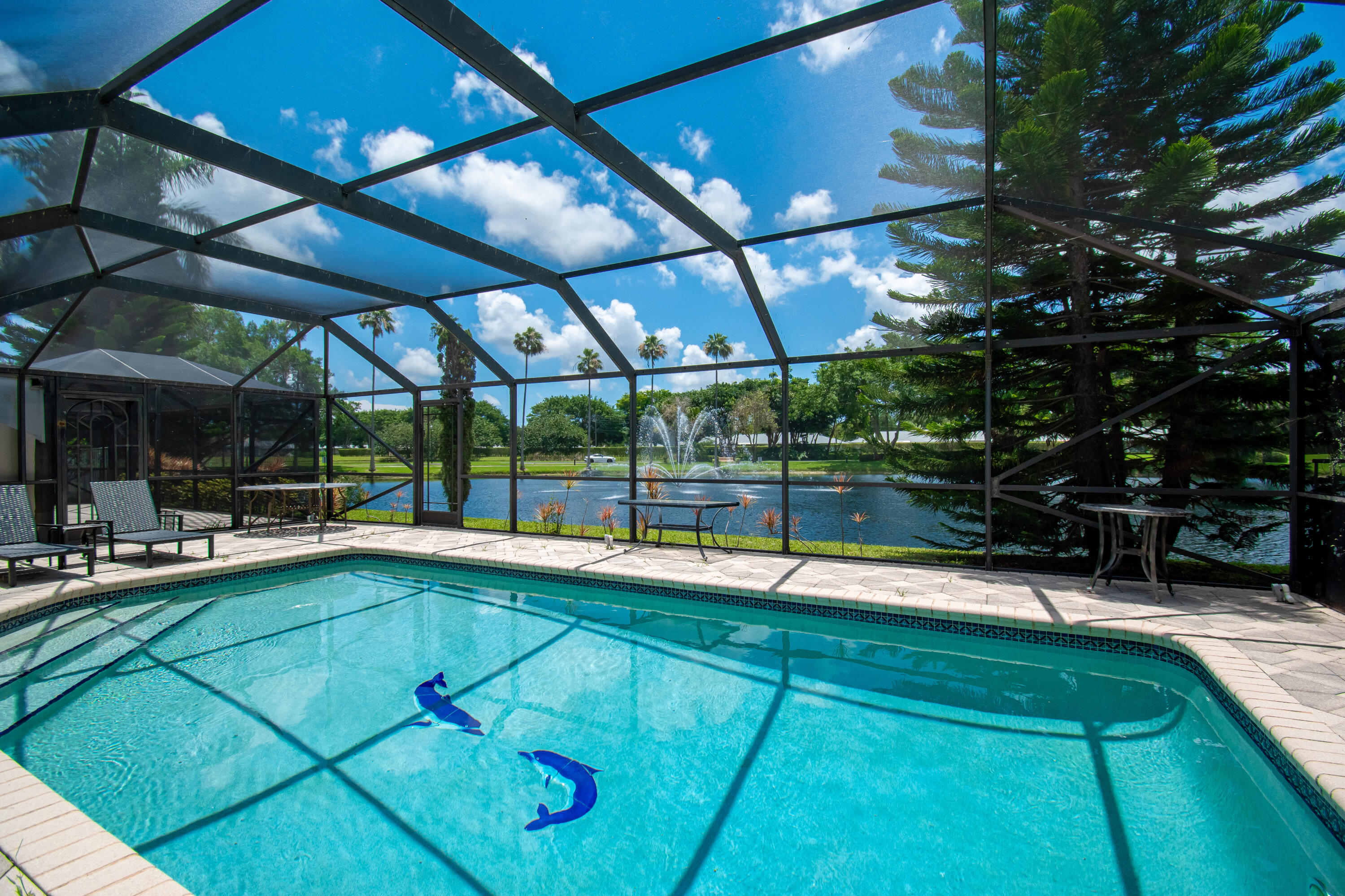 9708 Erica Court Boca Raton, FL 33496 - Photo 40 of 54 a view of a swimming pool with a patio