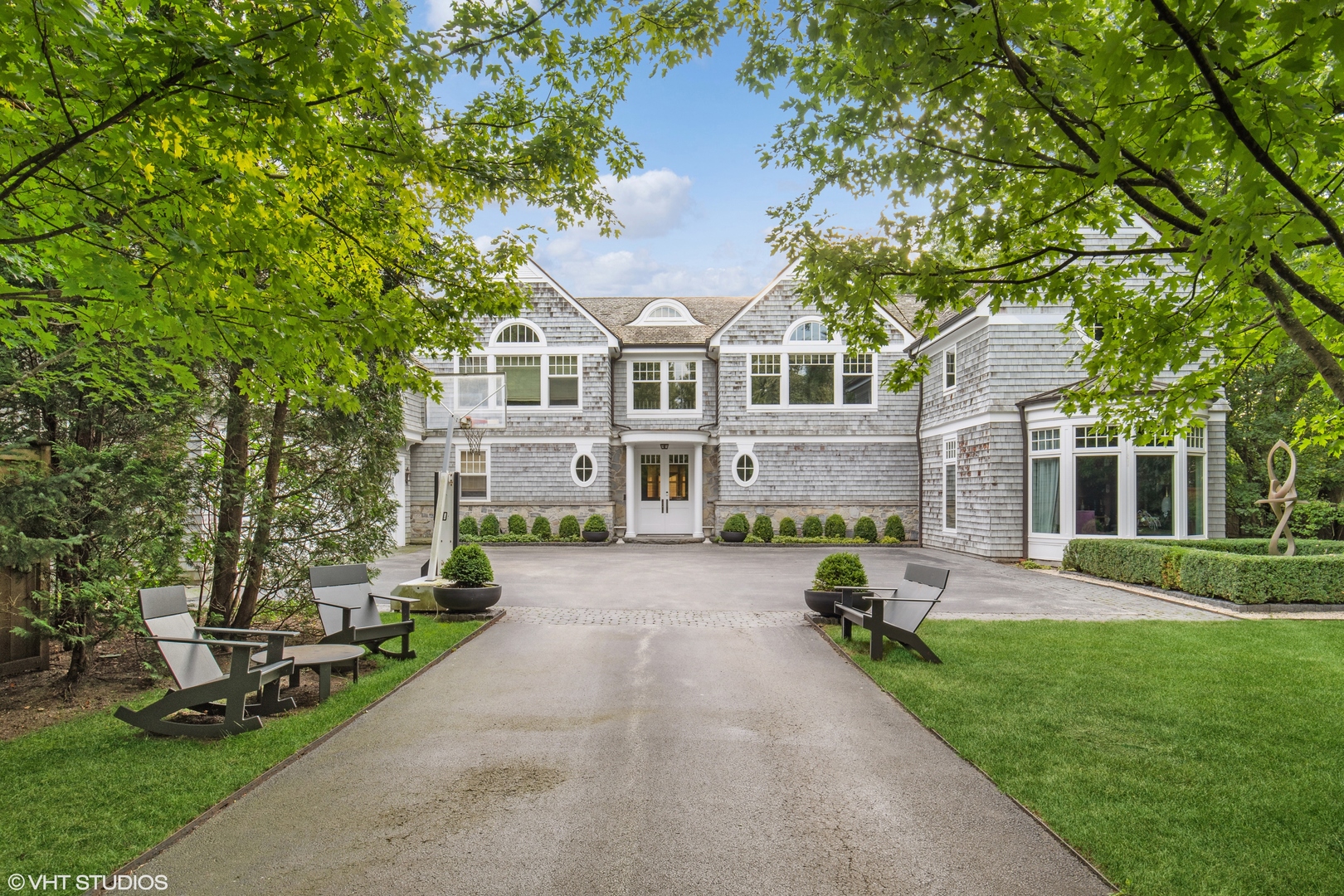 346 Grove Street Glencoe, IL 60022 - Photo 4 of 61 a view of a big house with a big yard and large trees