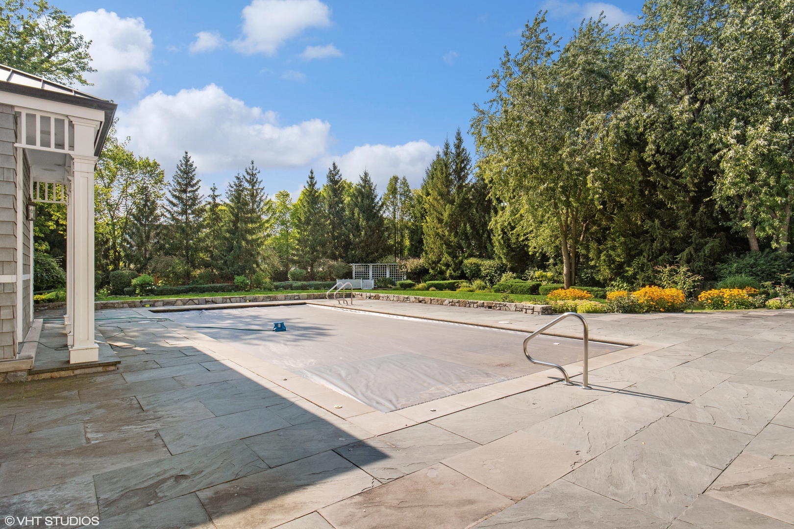 346 Grove Street Glencoe, IL 60022 - Photo 43 of 61 a view of a swimming pool with an outdoor space and seating area