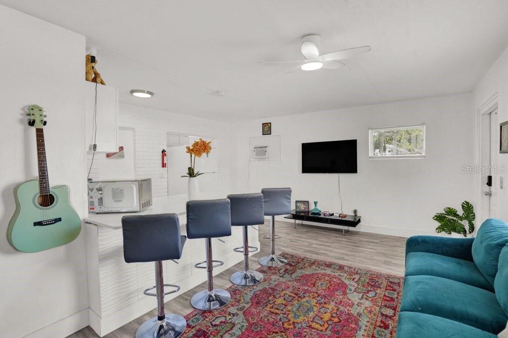 7871 Terrace Road Lantana, FL 33462 - Photo 11 of 19 a living room with furniture and a flat screen tv