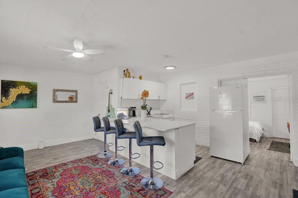 7871 Terrace Road Lantana, FL 33462 - Photo 16 of 19 a living room with a sink and a rug