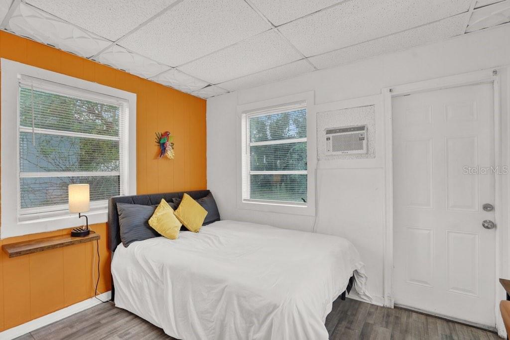 7871 Terrace Road Lantana, FL 33462 - Photo 18 of 19 a bedroom with a bed and wooden floor