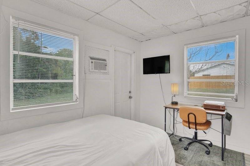 7871 Terrace Road Lantana, FL 33462 - Photo 19 of 19 a bedroom with a bed and a flat screen tv