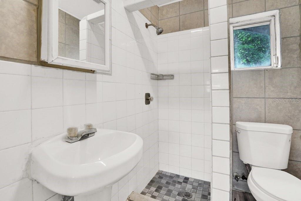 7871 Terrace Road Lantana, FL 33462 - Photo 5 of 19 a bathroom with a toilet and a sink