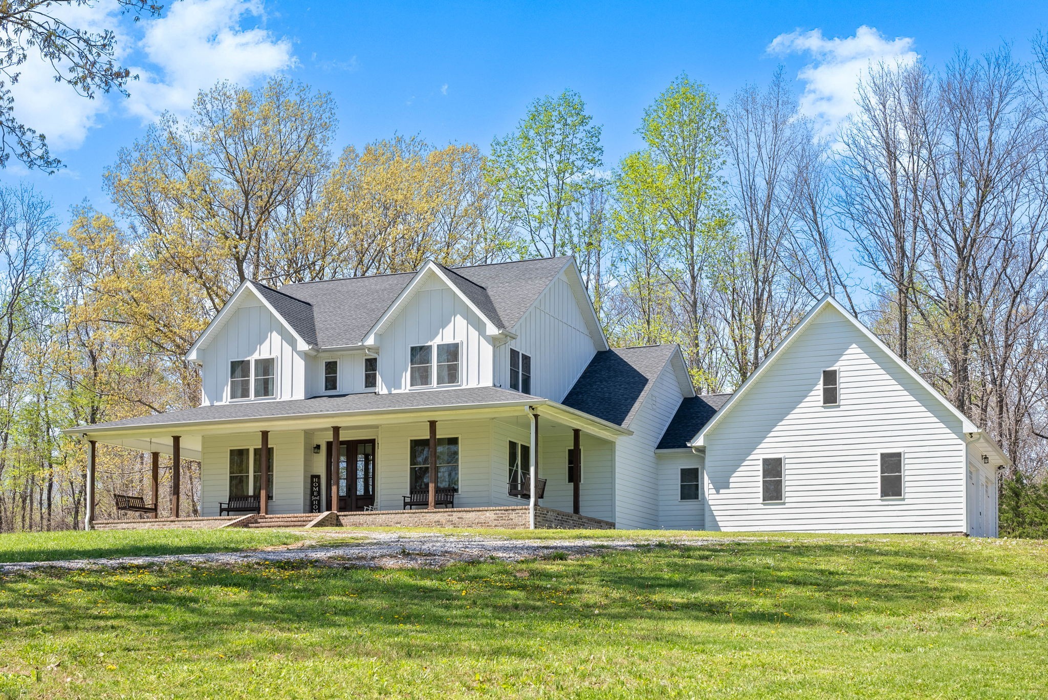234 Davis Lane Erin, TN 37061 - Photo 4 of 45 a front view of a house with a garden