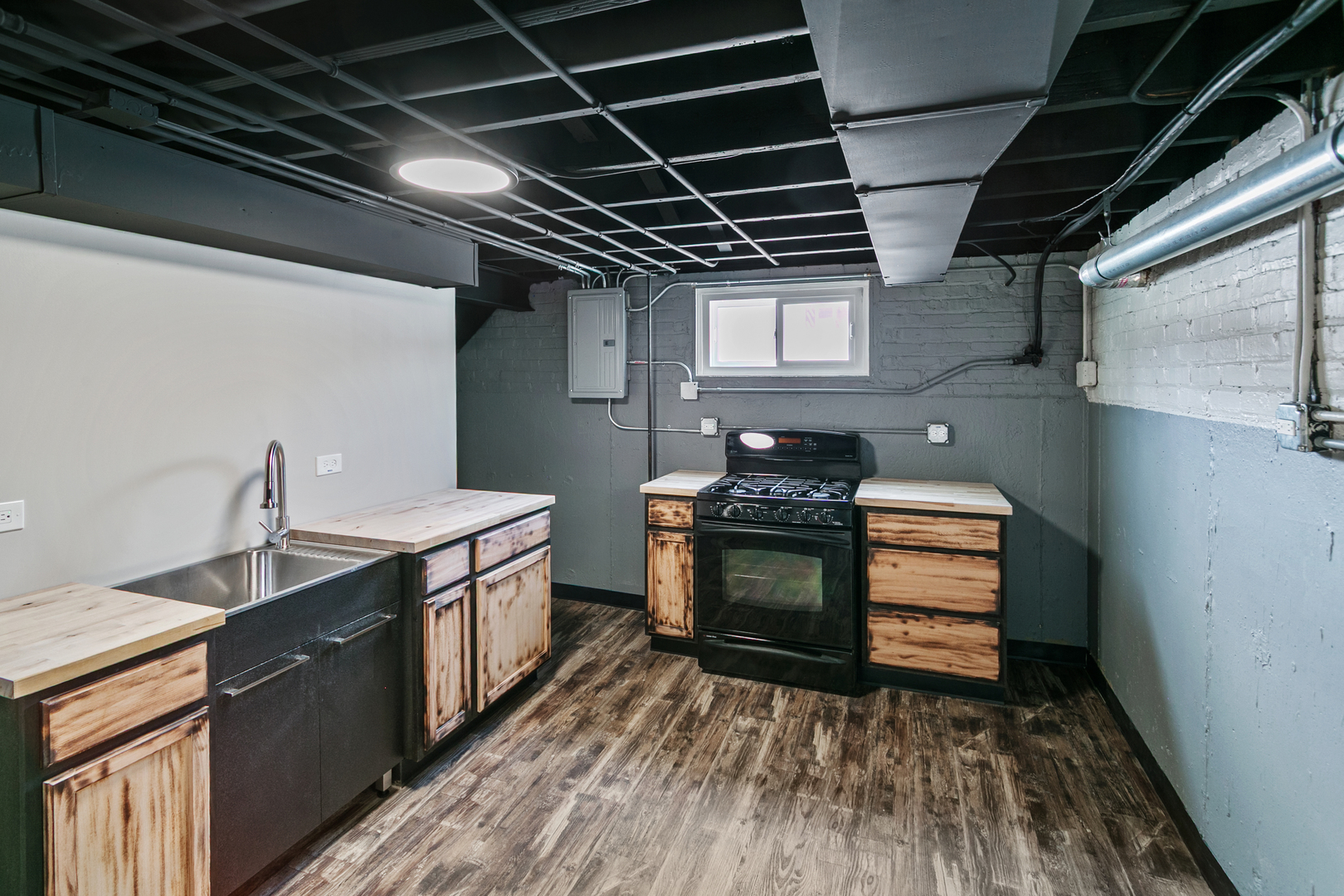 7021 West 64th Street Chicago, IL 60638 - Photo 22 of 23 a kitchen with sink stove and cabinets
