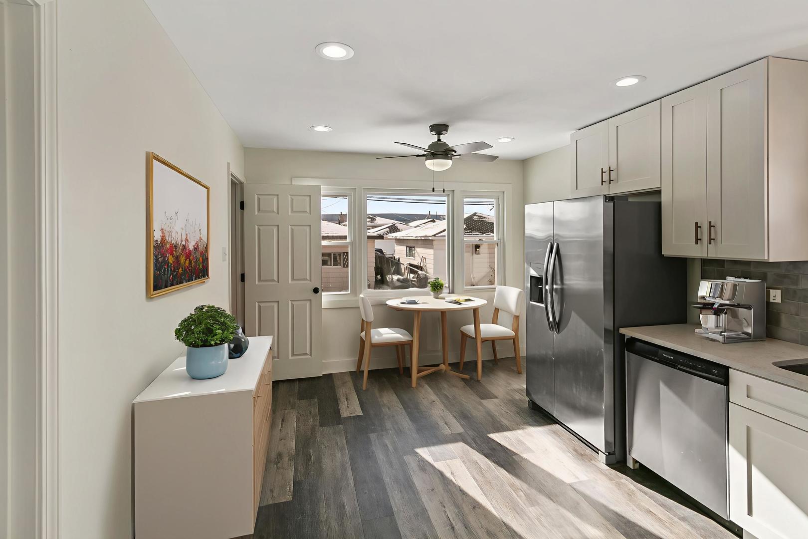 7021 West 64th Street Chicago, IL 60638 - Photo 7 of 23 a kitchen with a refrigerator and white cabinets