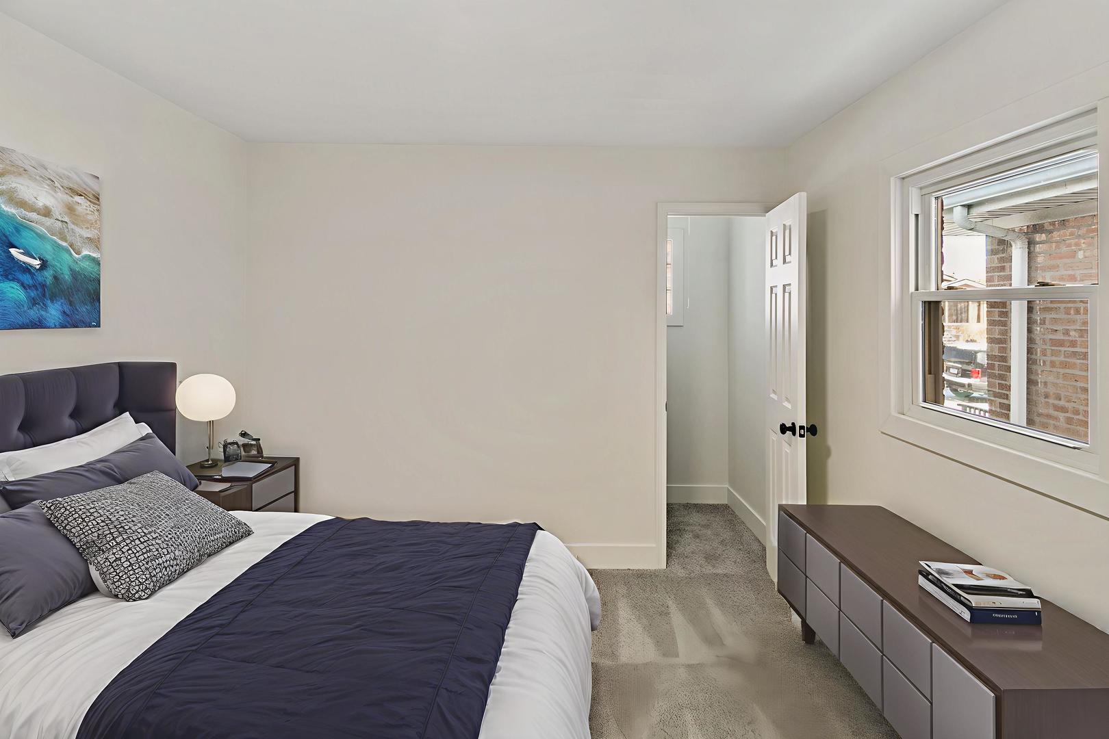 7021 West 64th Street Chicago, IL 60638 - Photo 10 of 23 a bedroom with a bed and wooden floor