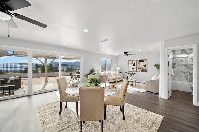 a view of a dining room with furniture window and wooden floor