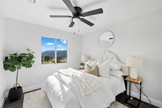 a bed sitting in a bedroom next to a window