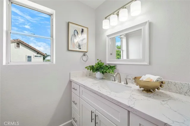 a bed room with a bed and a potted plant