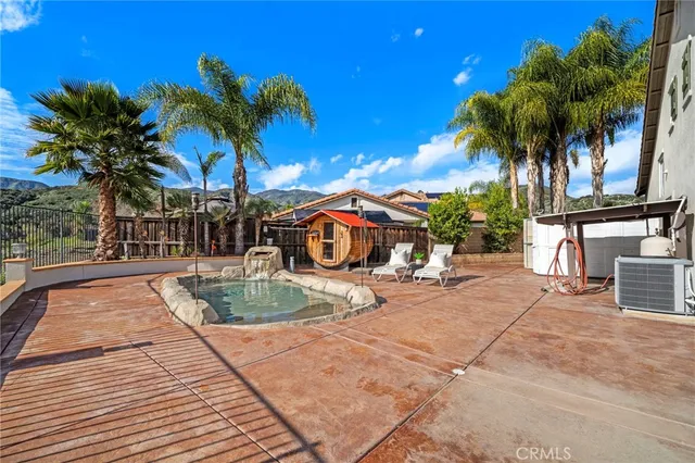 a view of a patio with table and chairs and potted plants