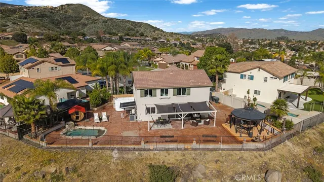 a view of a swimming pool with a yard and mountain view