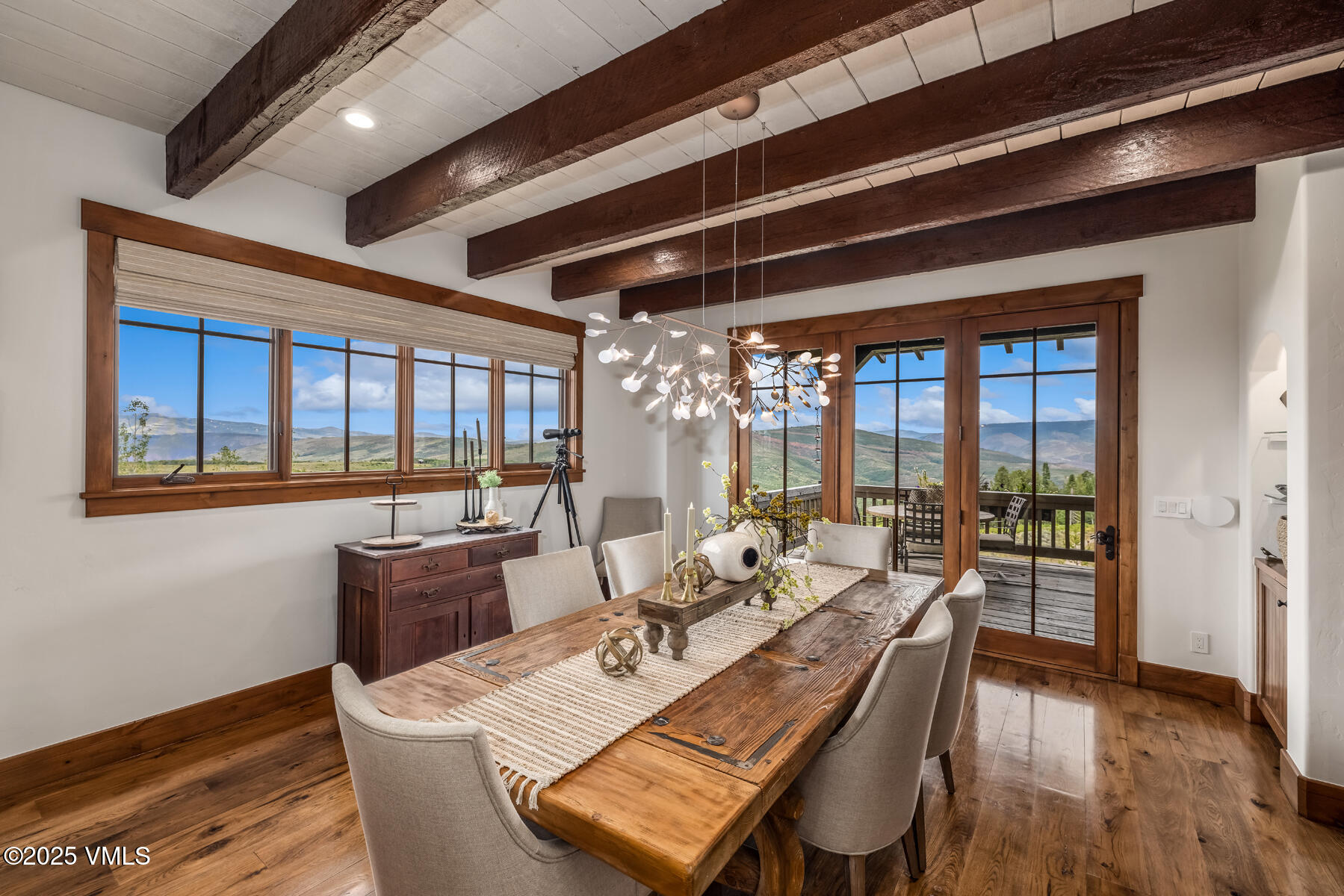 254 Pine Marten Way Edwards, CO 81632 - Photo 12 of 46 a view of a dining room with furniture window and wooden floor
