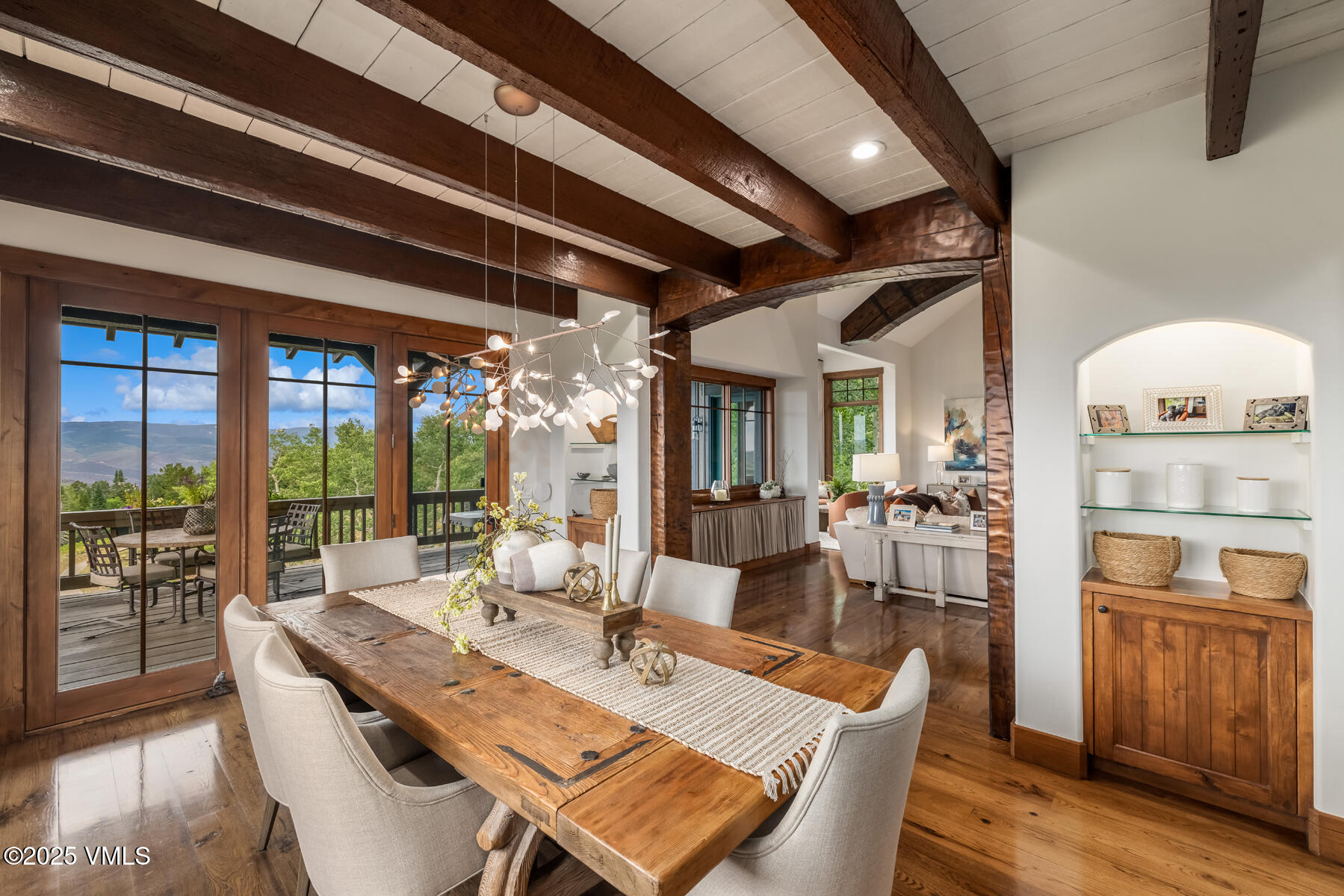 254 Pine Marten Way Edwards, CO 81632 - Photo 13 of 46 a dining room with wooden floor and furniture
