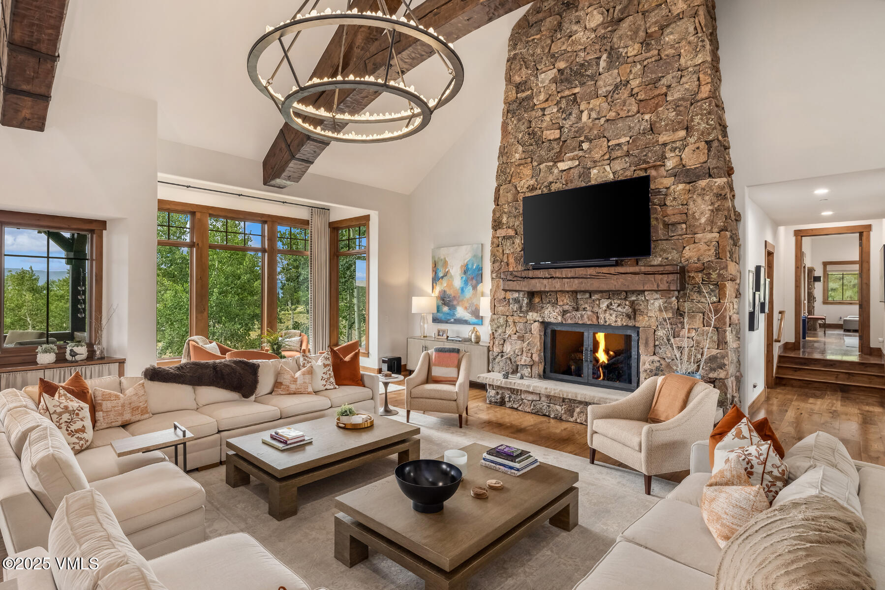 254 Pine Marten Way Edwards, CO 81632 - Photo 2 of 46 a living room with furniture a fireplace and a flat screen tv