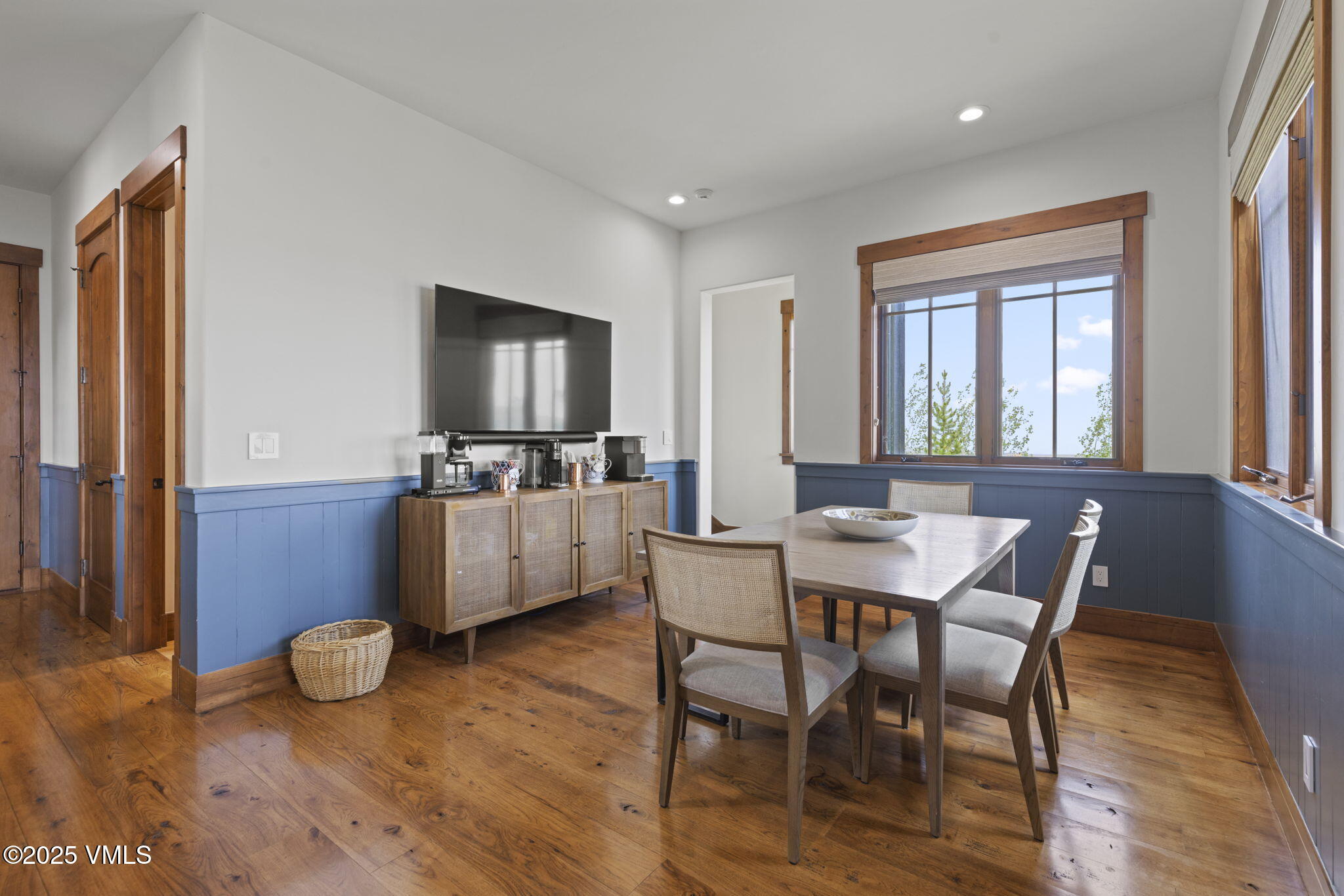 254 Pine Marten Way Edwards, CO 81632 - Photo 23 of 46 a view of a dining room with furniture window and wooden floor